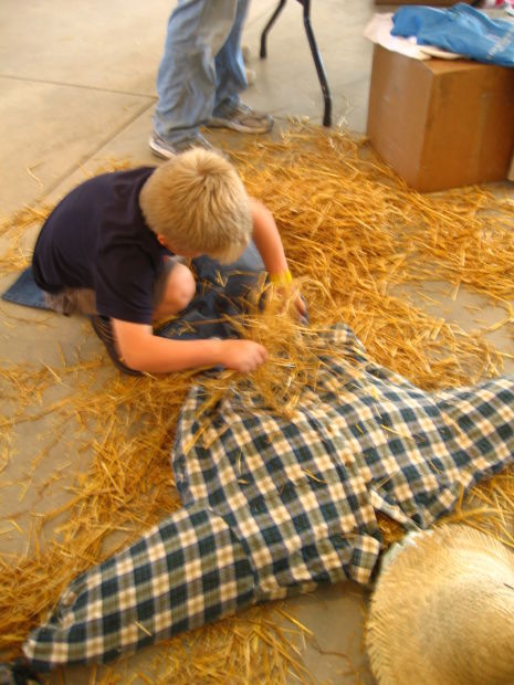 boy making scarecrow
